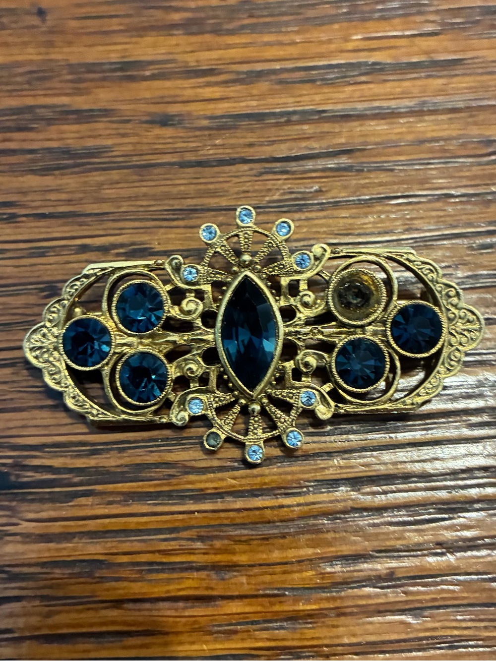 Gold-Tone Brooch with Deep Blue Crystal Accents
